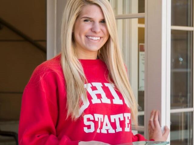 Ohio State Student Holding Reusable Container
